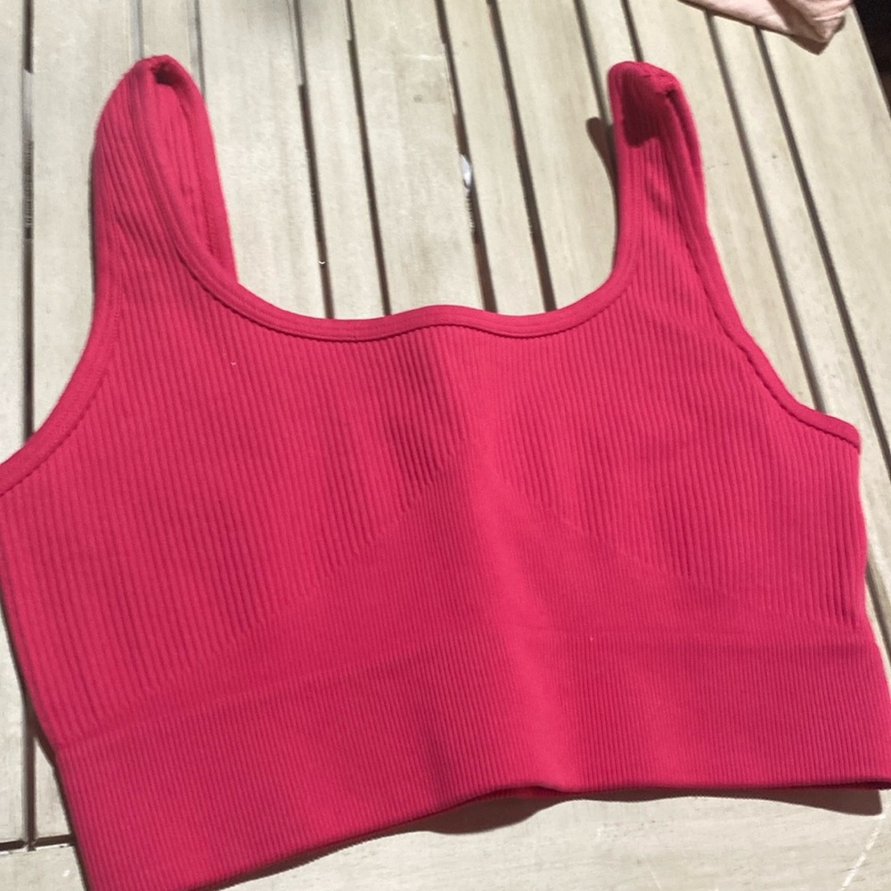 A pink cropped tank top
